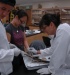 A photo of Crow looking at a spiny dogfish's brain with Tracy Chan and JR Clark.